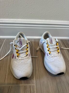 Nike Winflow White Sneakers with Purple Swoosh and Yellow Eyelets